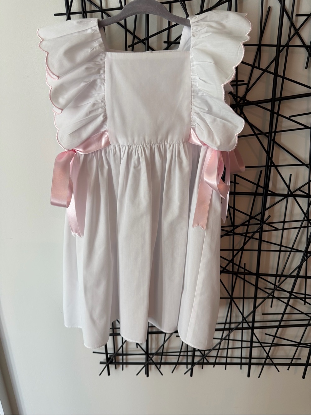 White Girls' Ruffle Dress with Pink Ribbon Accents